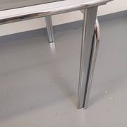 Vintage oval dining table in smoked glass and chrome metal, Space Age style.