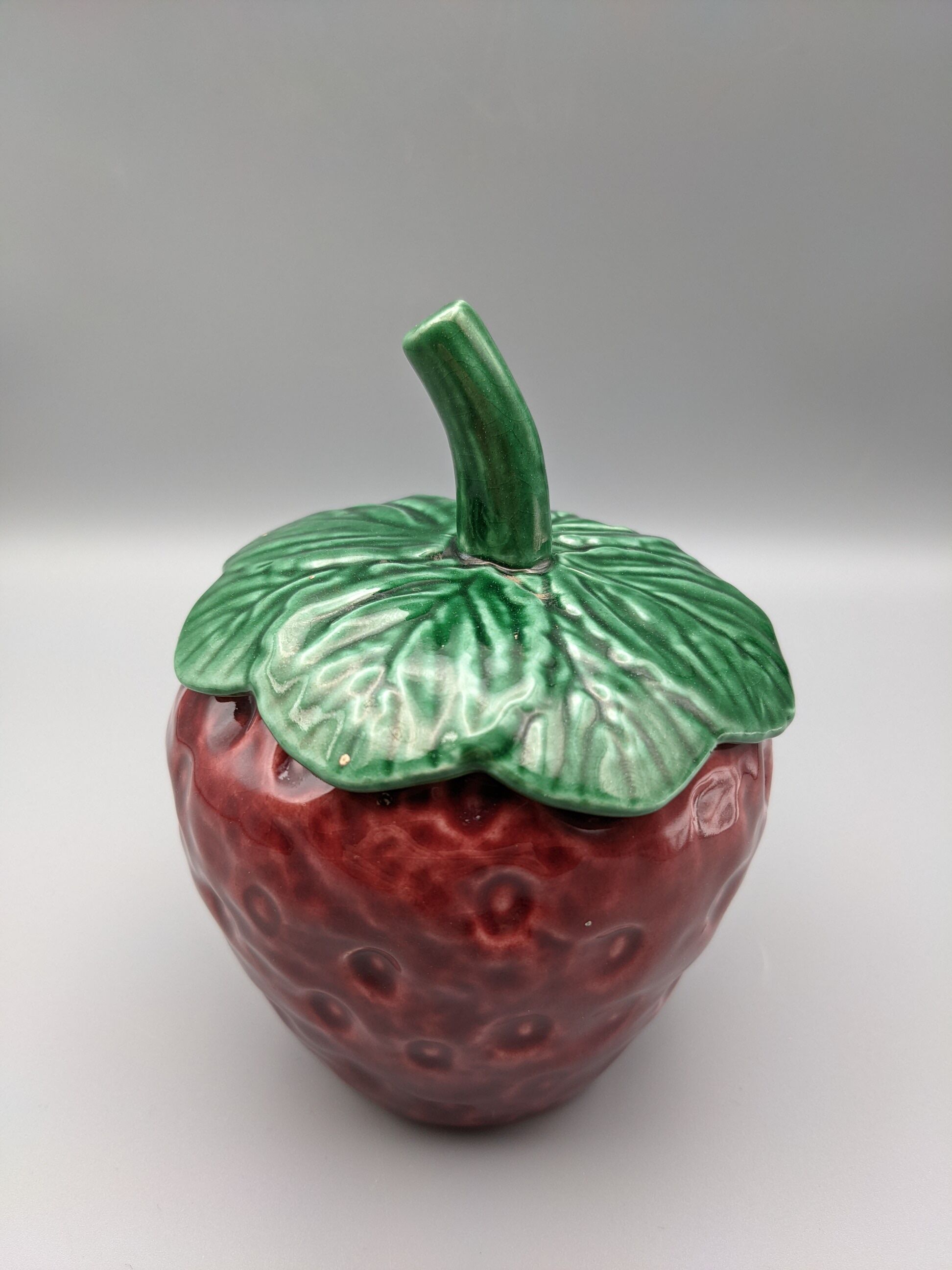 Condiment jar mustard jam in the shape of strawberry