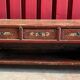 Enfilade, banc en bois laqué rouge à décor floral polychrome, Chine XIXème