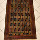 Persian carpet, hand-knotted, geometric design.
