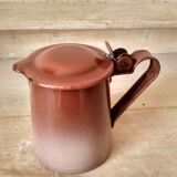 Old pitcher in brown enamelled sheet metal, spout and lid