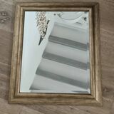 Beveled mirror under gold frame