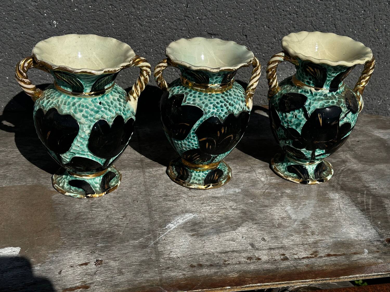 Trio of Vallauris vases in turquoise and black, highlighted with gold, 22 cm high