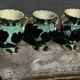 Trio of Vallauris vases in turquoise and black, highlighted with gold, 22 cm high