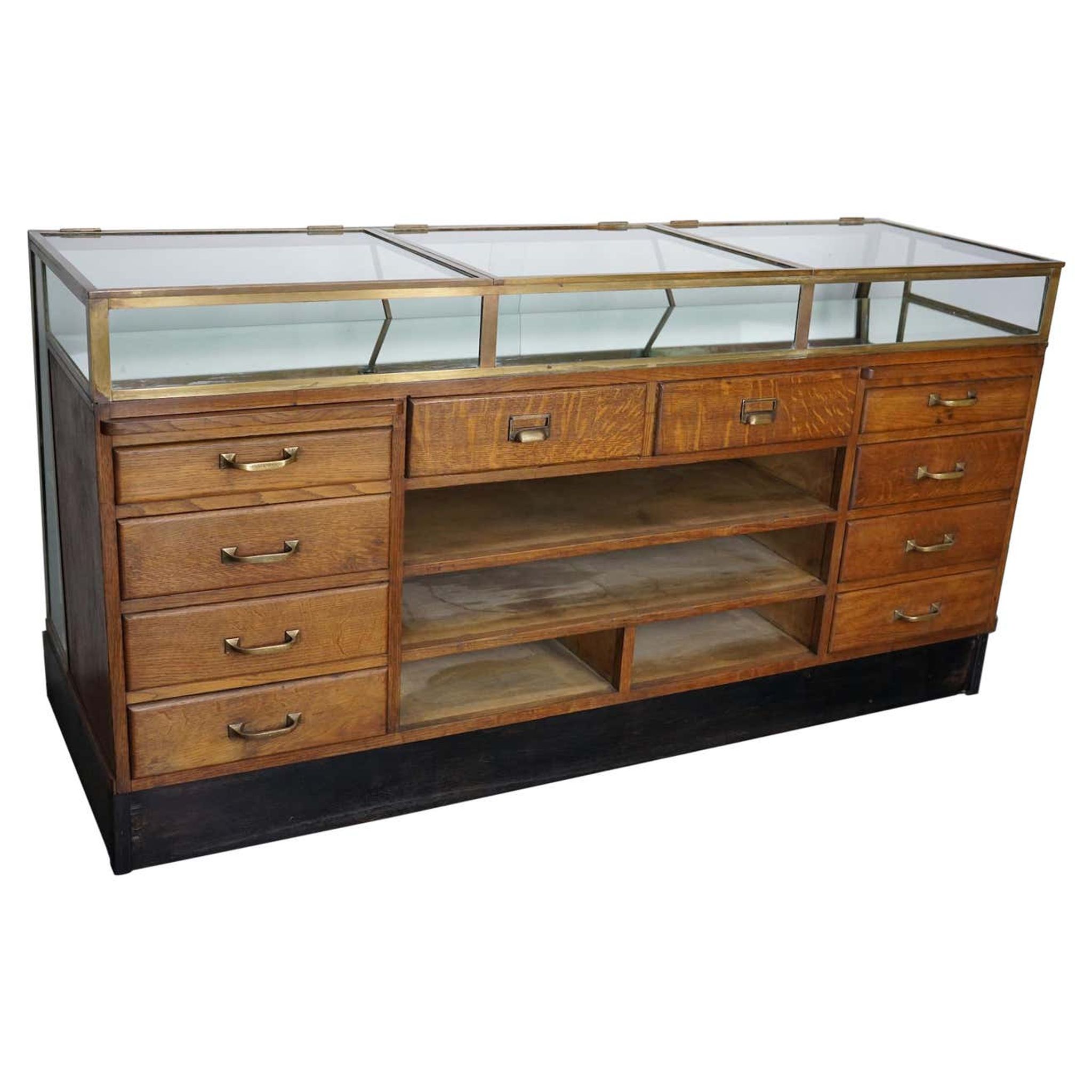 Counter or shop window in oak glass and brass France around 1920
