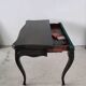 Molded blackened wooden play table, arched legs, green felt