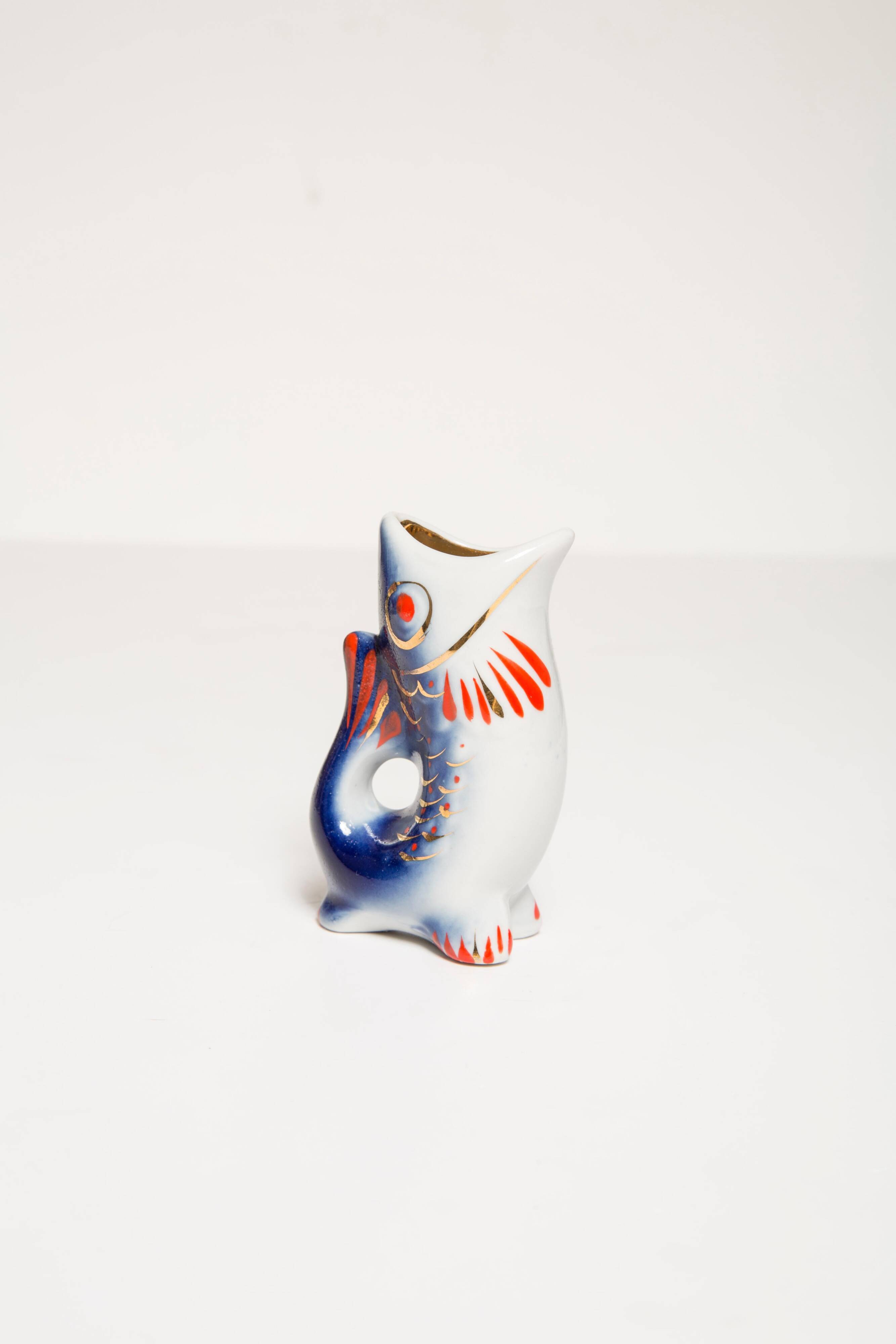 Set of 7 glasses and a glass carafe decorated with blue fish, Mid-Century Modern style, Europe, 1960s.