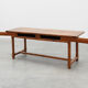 Rustic 19th century oak dinner table with drawers opening laterally, France