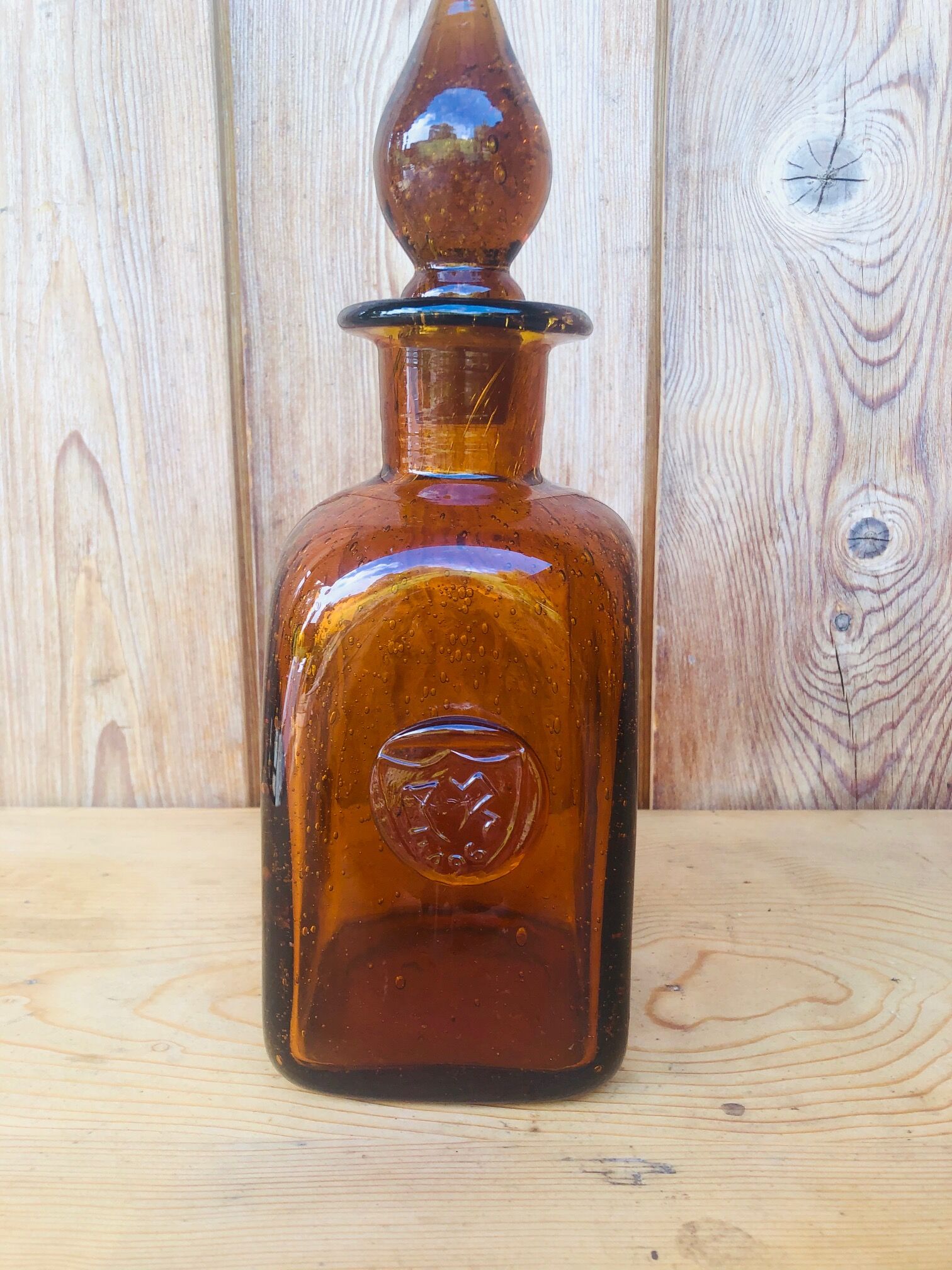 Old carafe in amber and bulled Biot glass, stamp 1496.