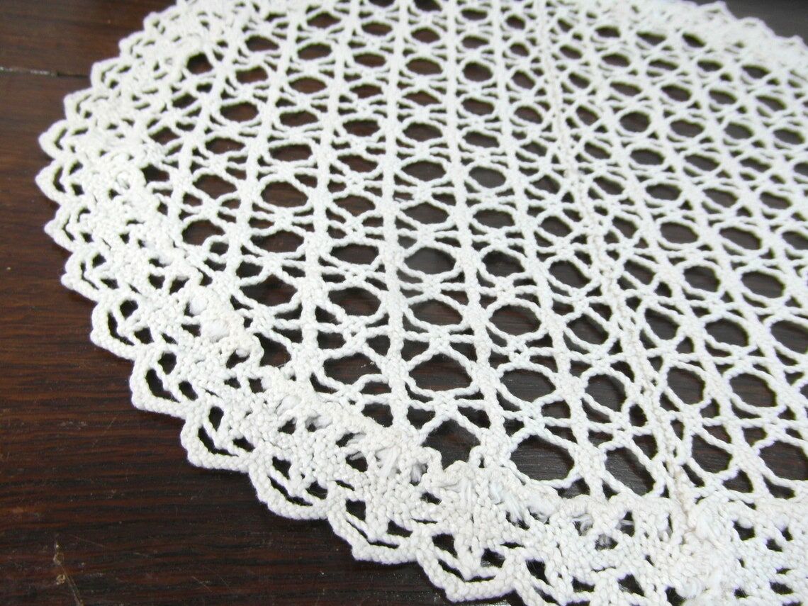 Handmade oval placemat in crocheted cotton lace