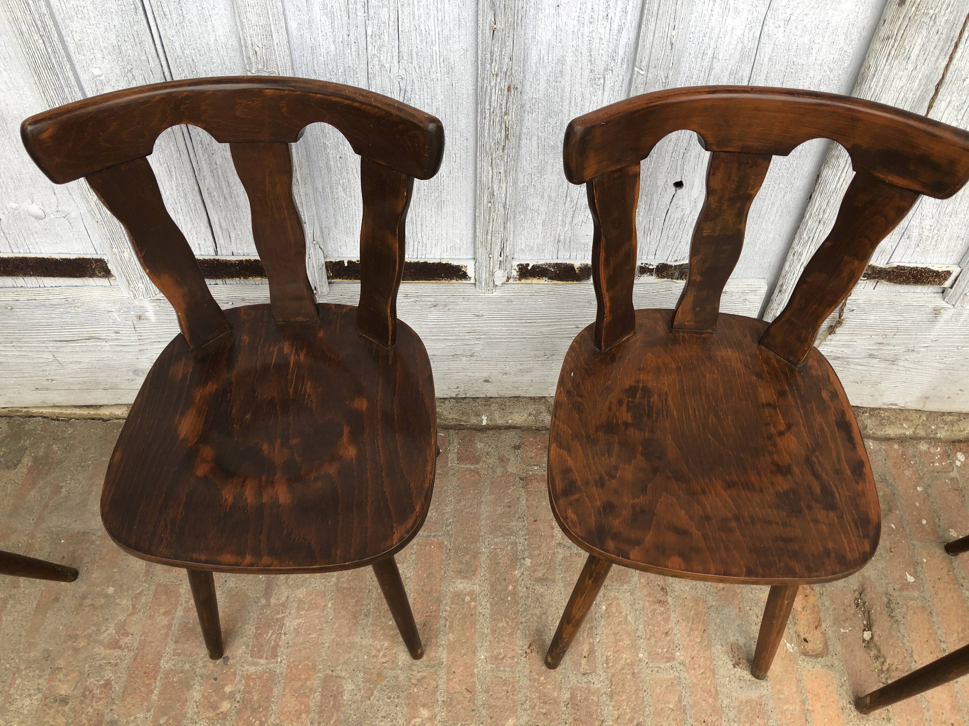 4 brutalist-style wooden chairs