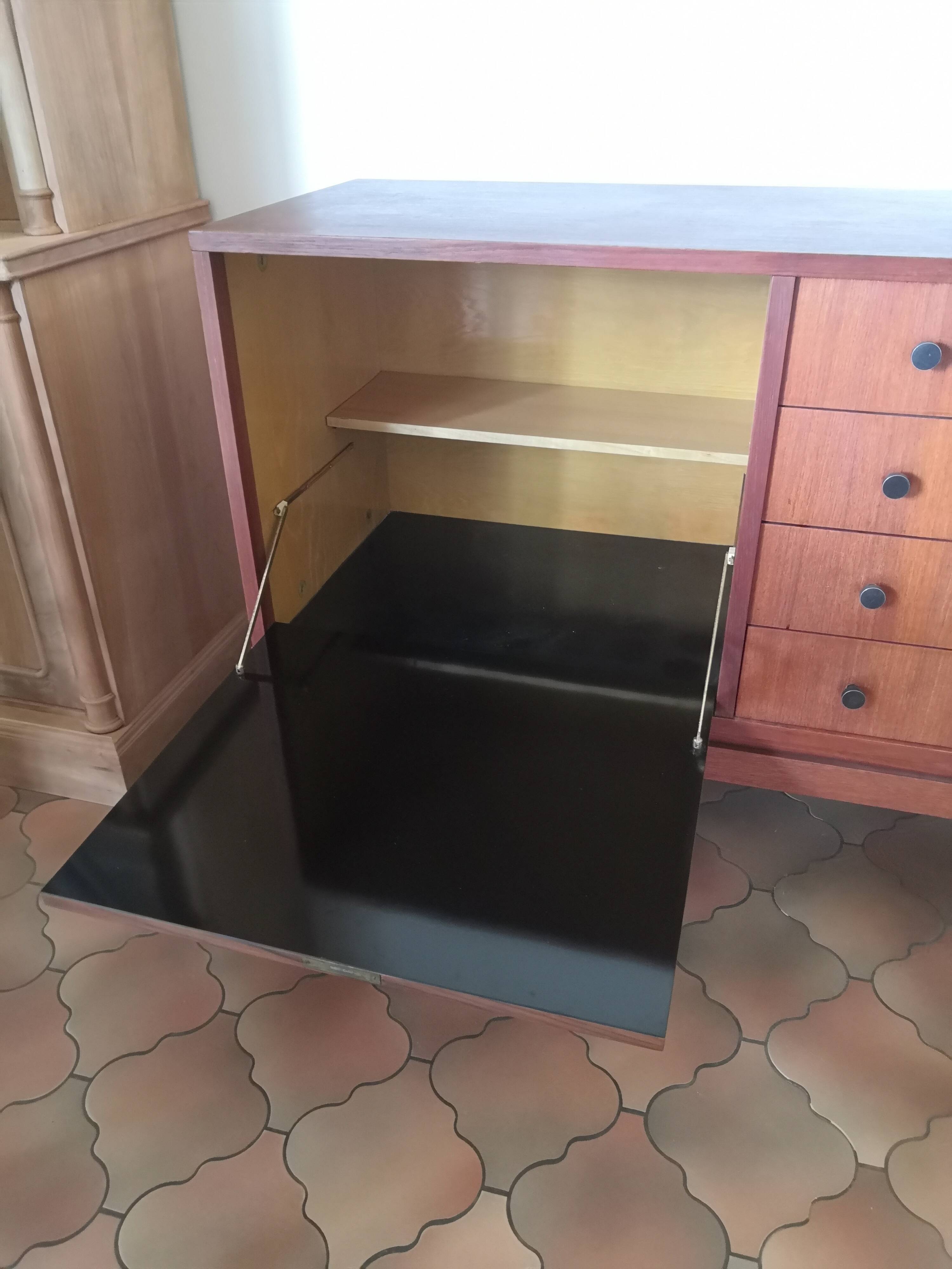 Vintage teak row with metal legs