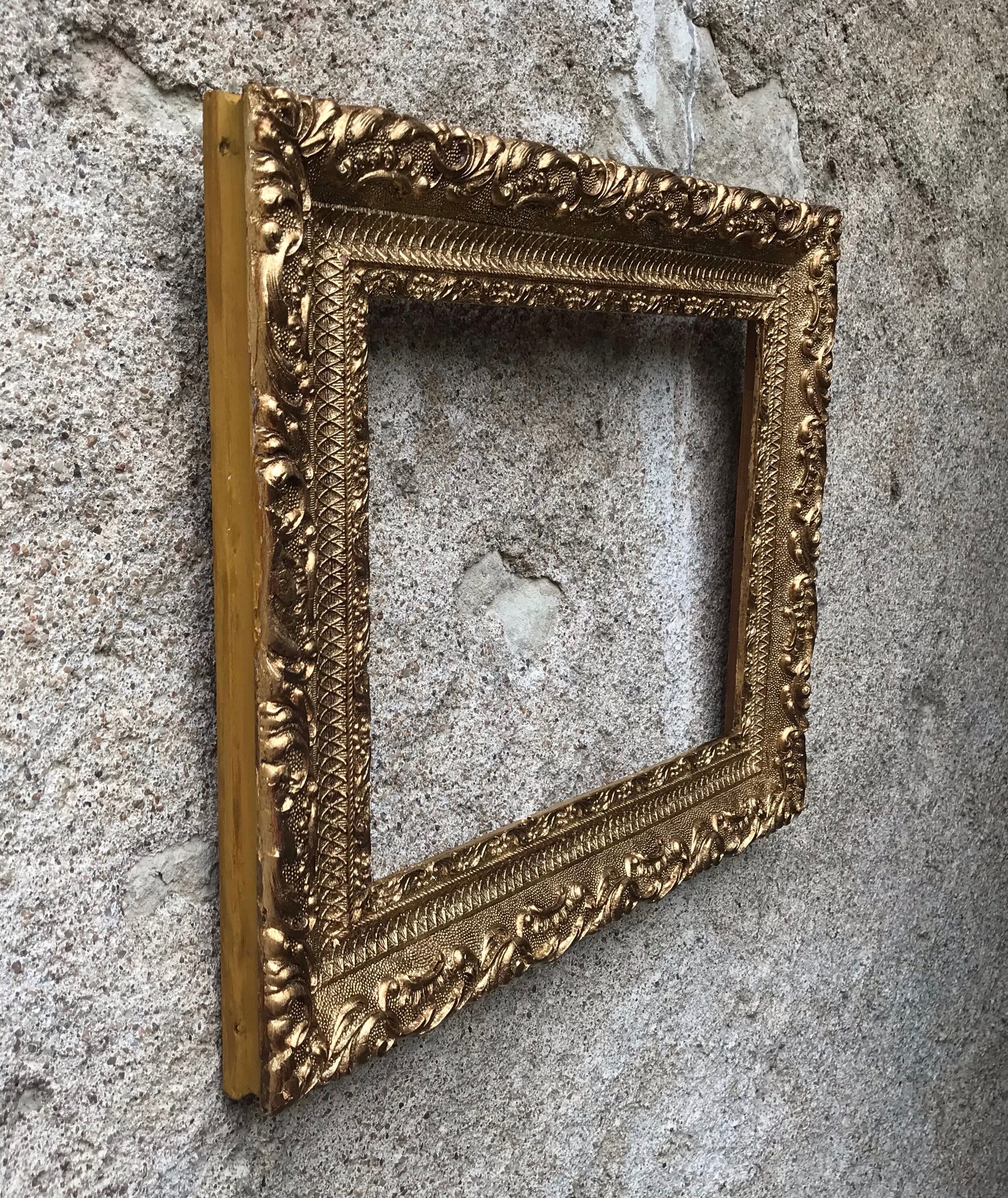 Old gilded frame with leaf