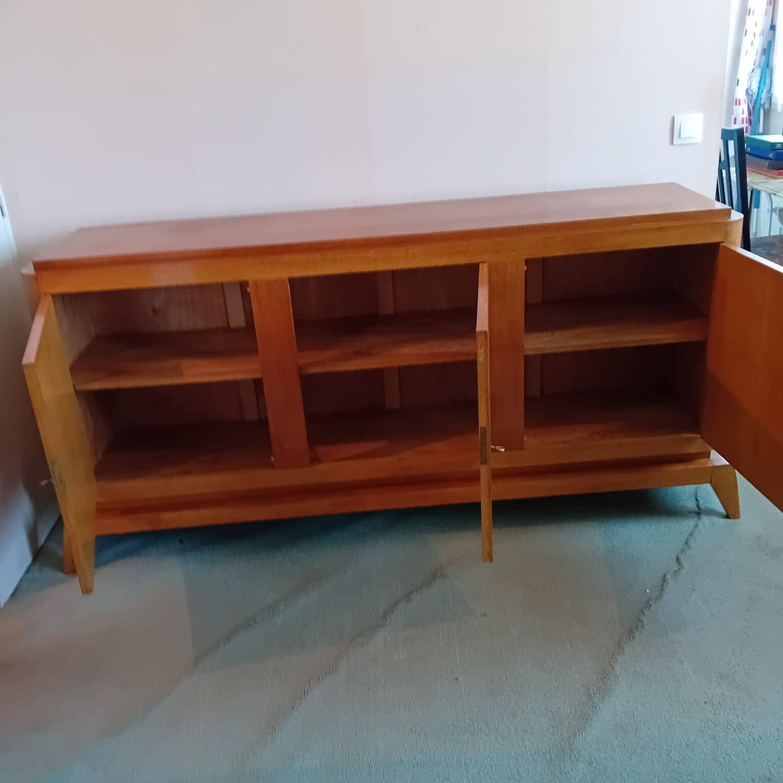 Large vintage sideboard with compass legs.