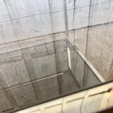 Square brass coffee table and smoked glasses