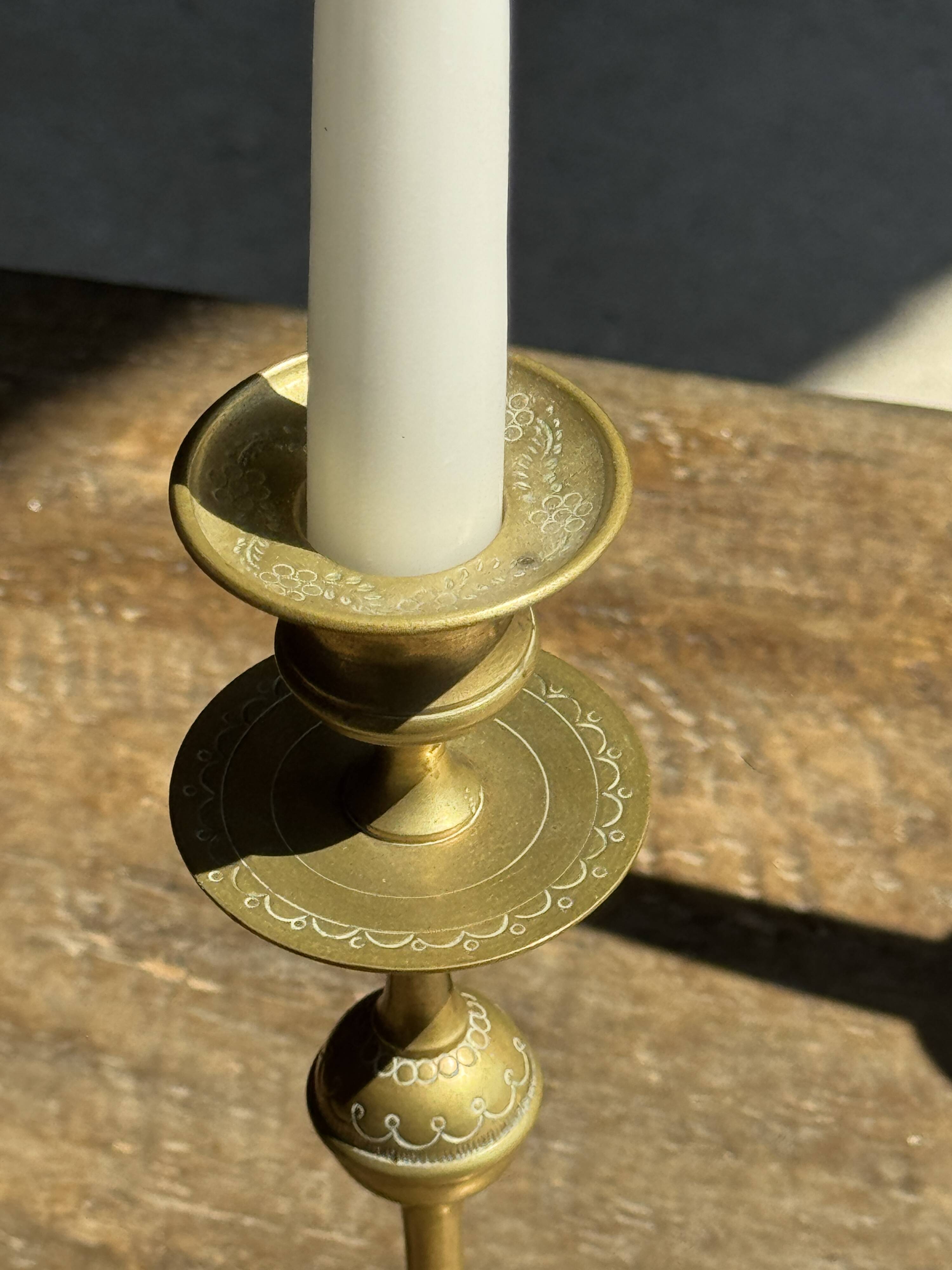 Pair of gilded candlesticks with engraved flower garland motifs H22