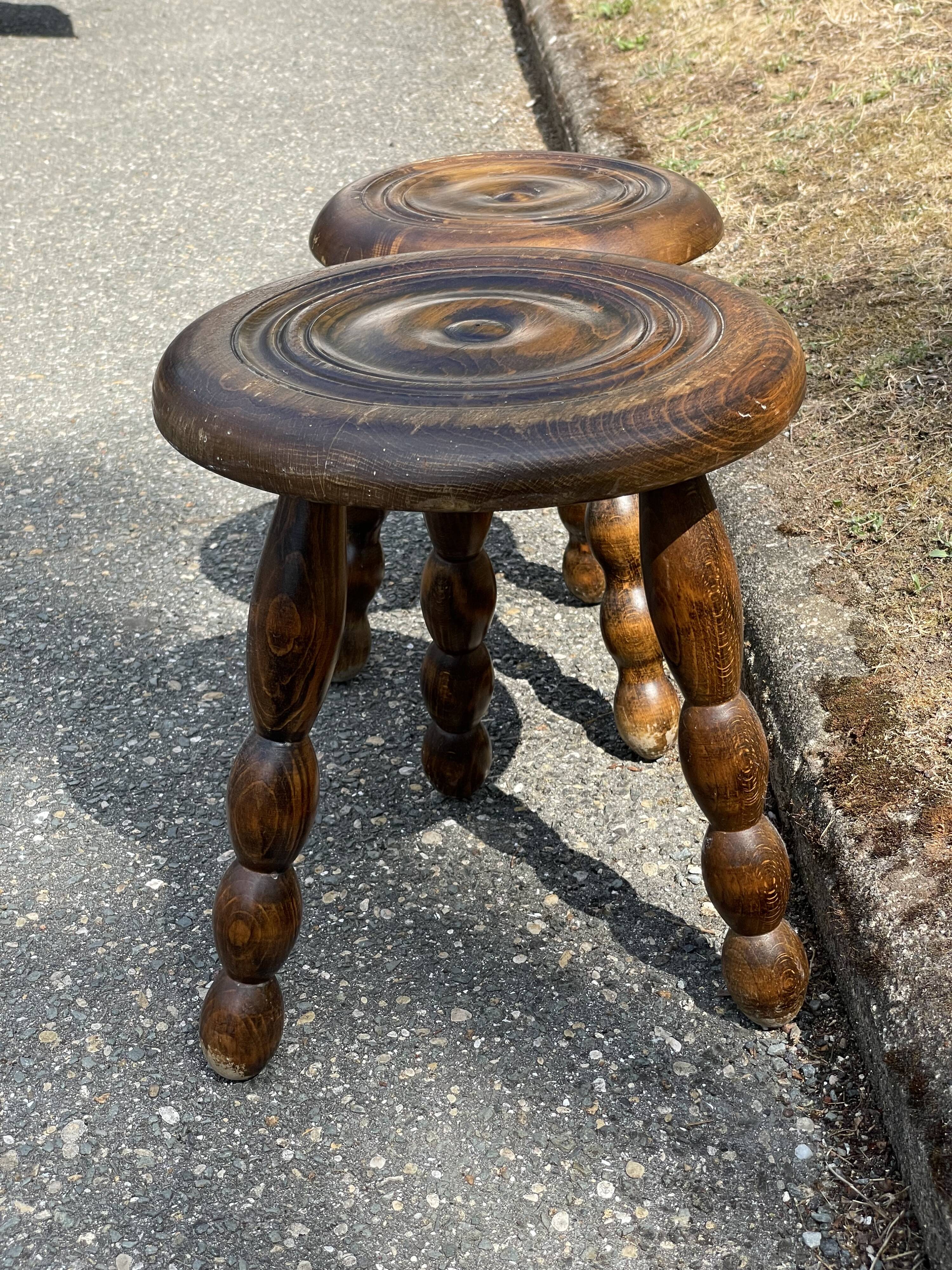 Duo of tripod oak stools