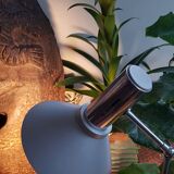 Chrome metal desk lamp and gray articulated arm