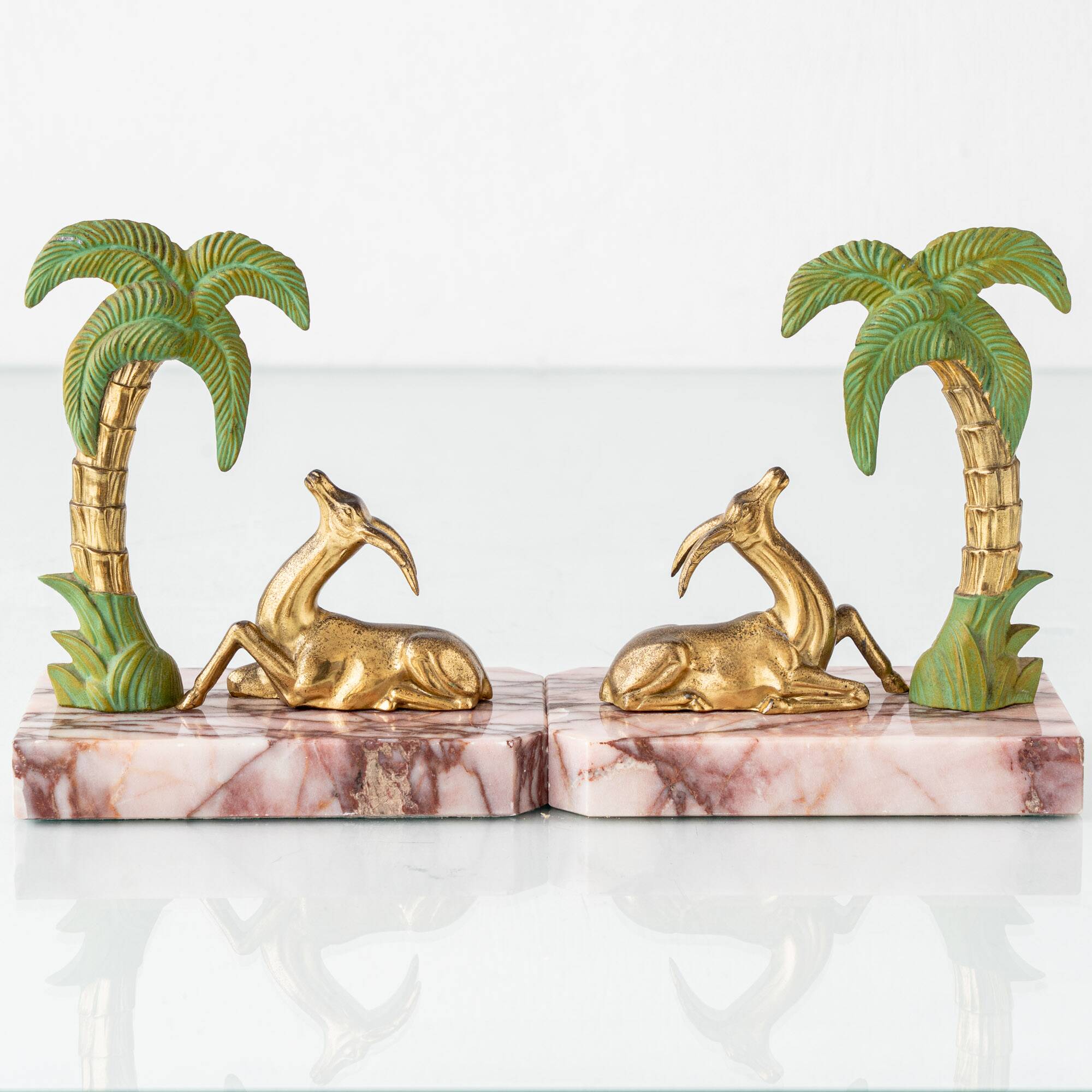 Pair of Art Deco Bookends in Pink Breccia Marble with Antelope and Palm Tree