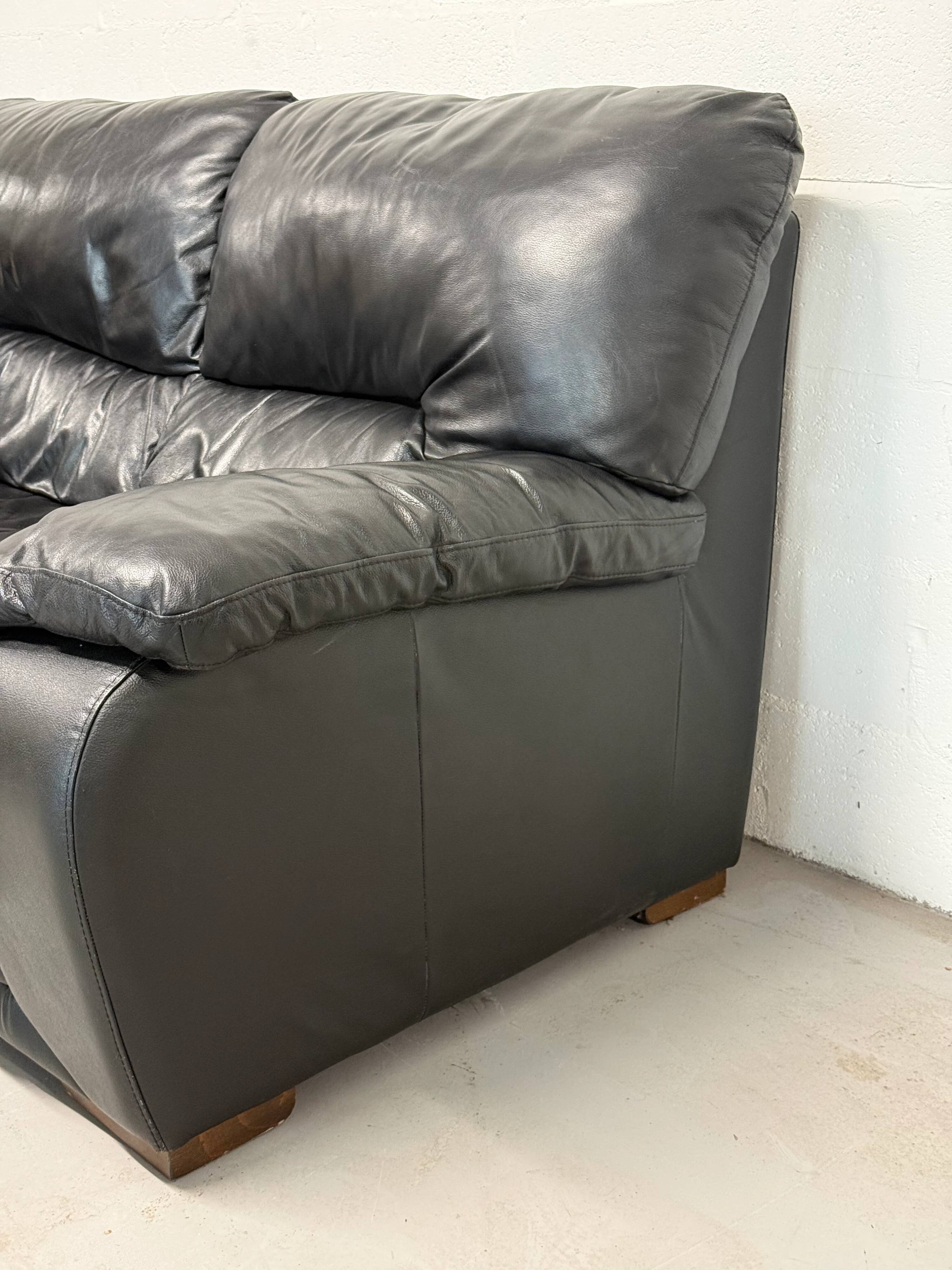 Two-seater black leather sofa — Italian postmodern design