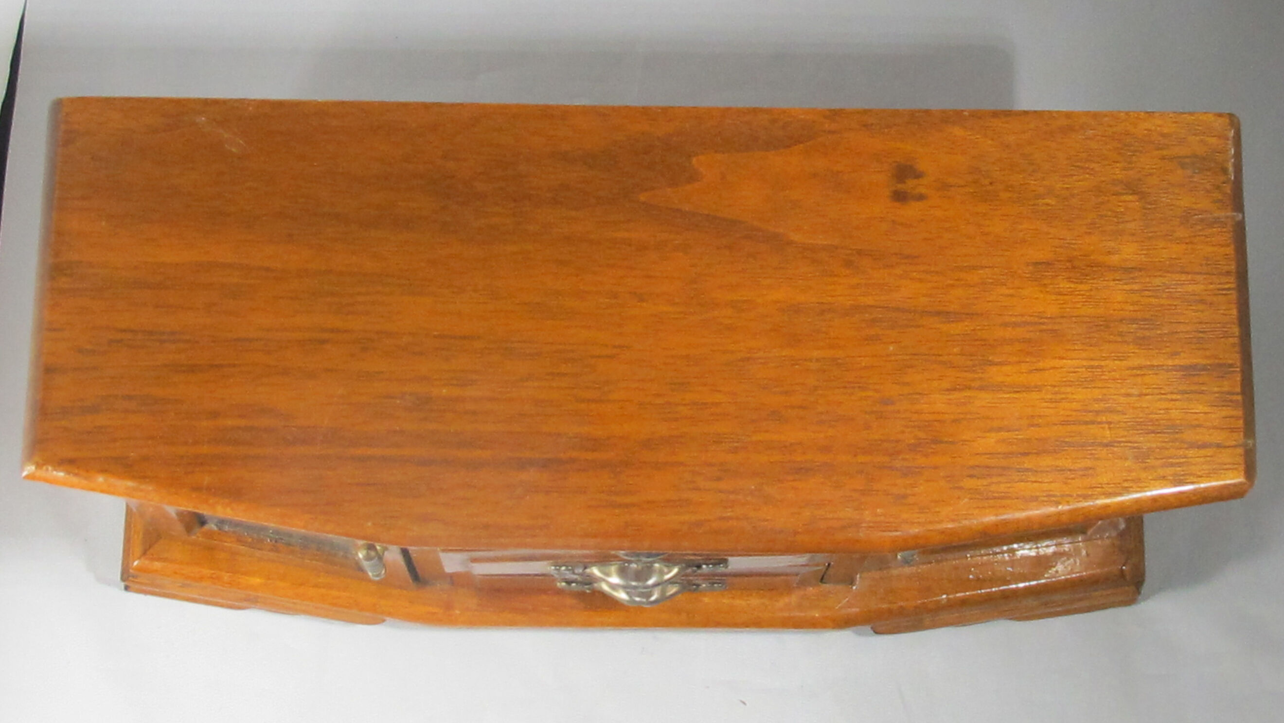 Wooden jewelry box in the shape of a chest of drawers