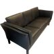 Black leather three-seater sofa