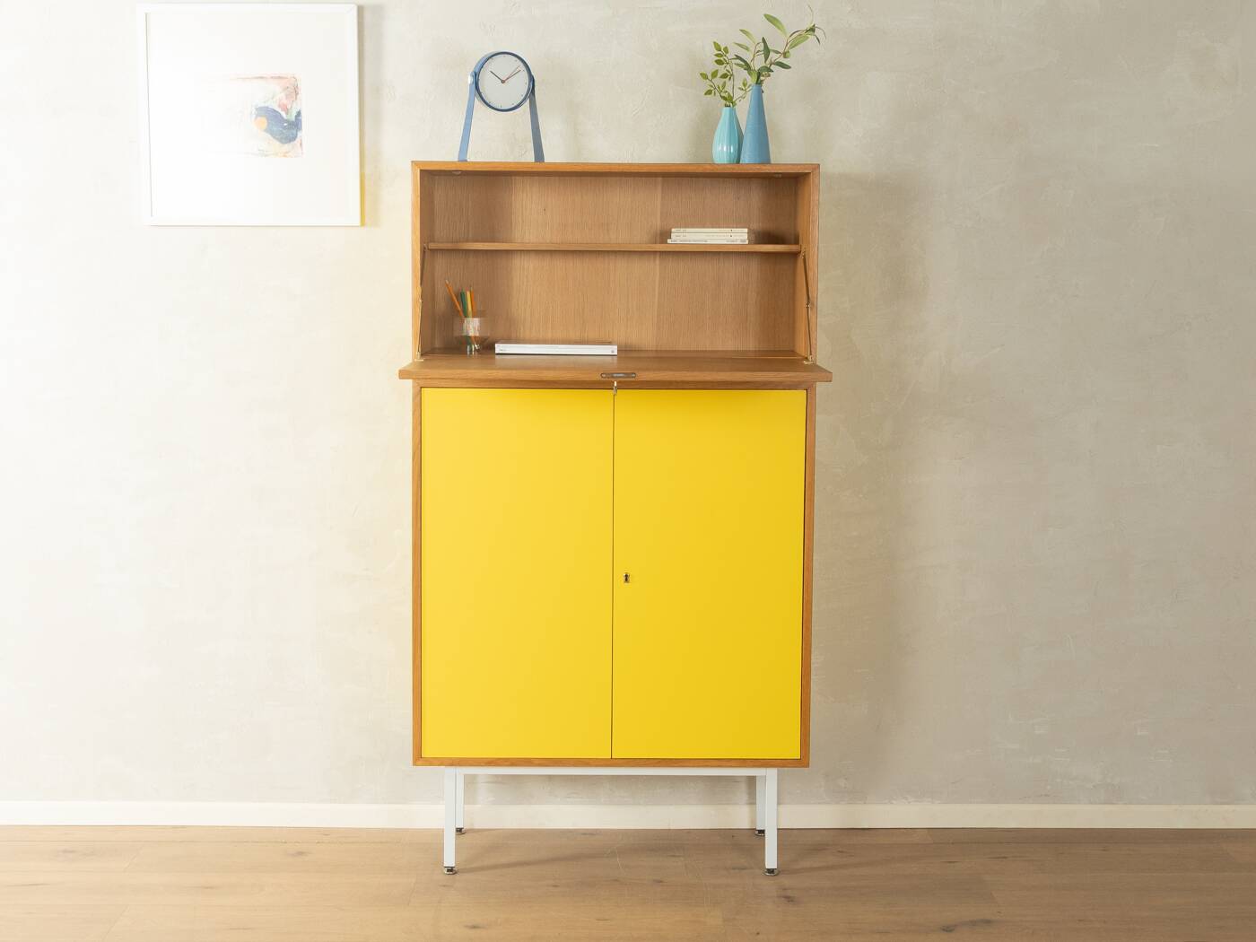 Classic sideboard from the 1960s, oak veneer, yellow Resopal, white steel feet