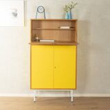 Classic sideboard from the 1960s, oak veneer, yellow Resopal, white steel feet