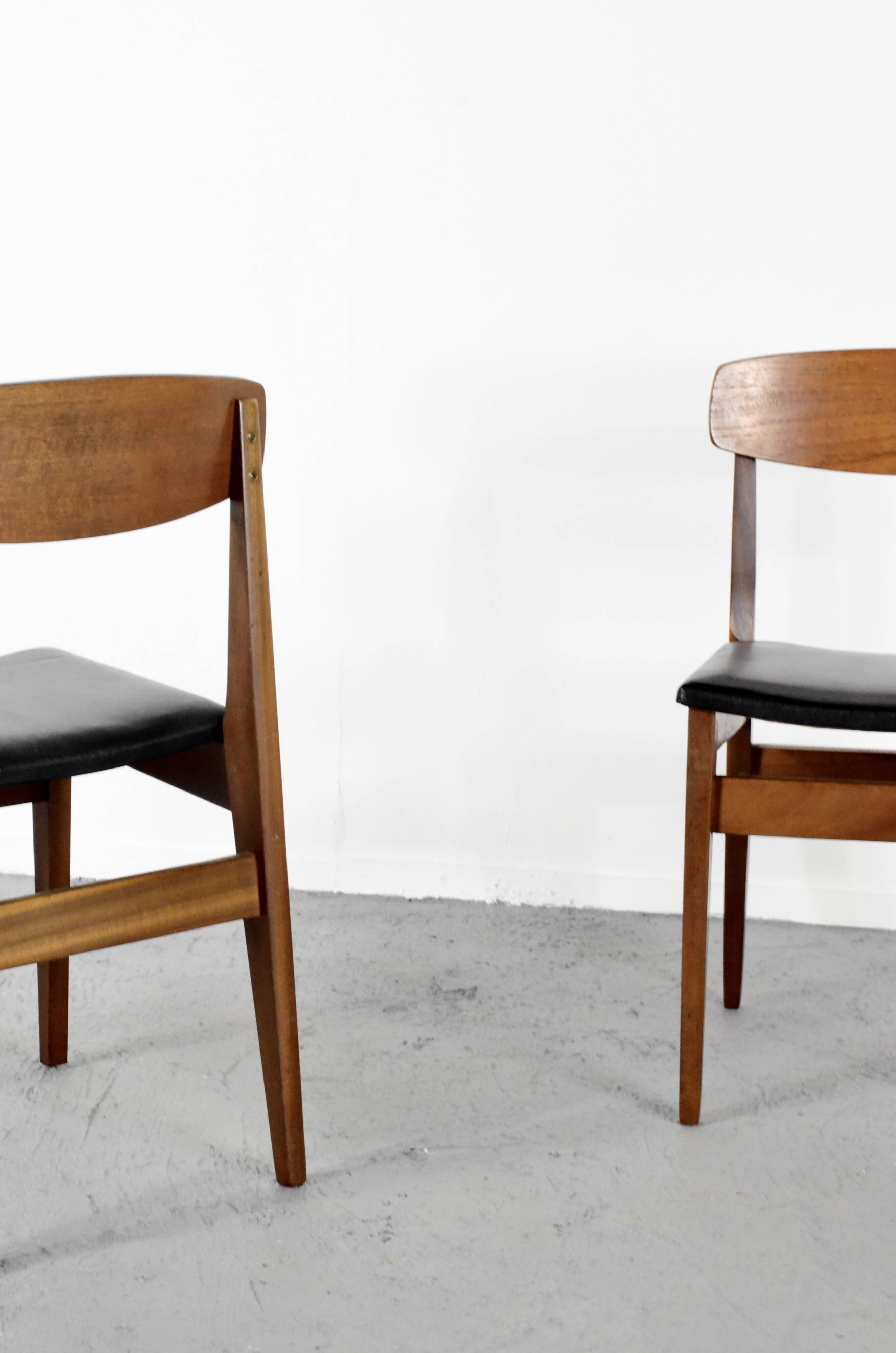Set Of 4 Midcentury Teak And Leatherette Chairs.