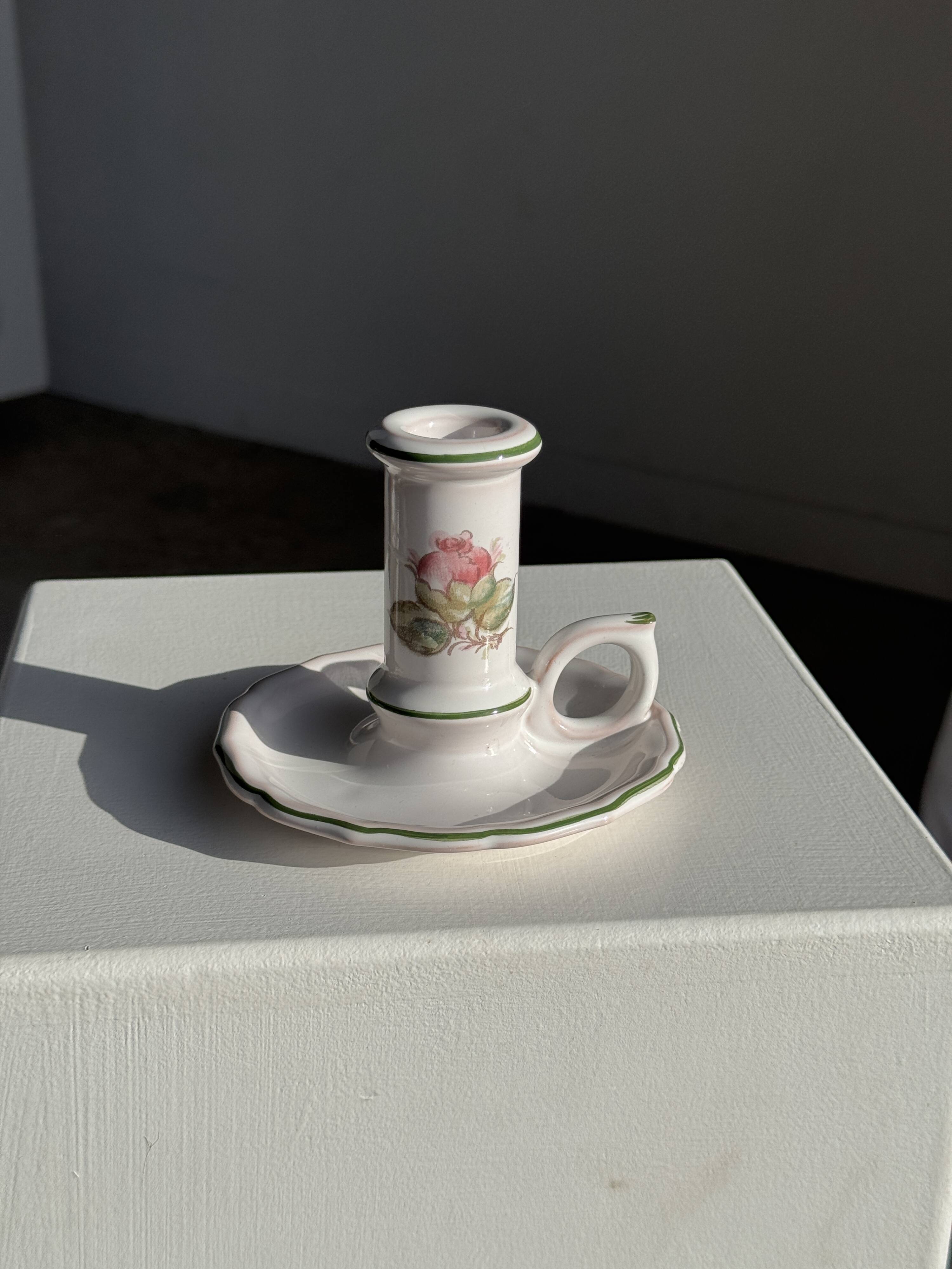 Small vintage hand-held candlestick in earthenware with green trim and floral decoration H10.5