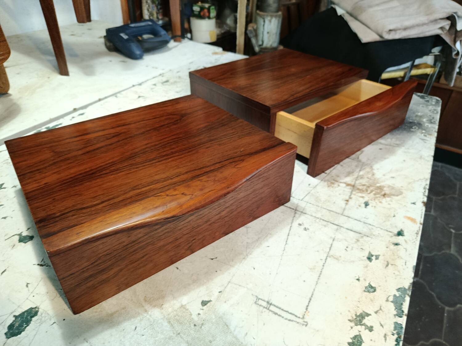 Scandinavian suspended bedside tables in rosewood.