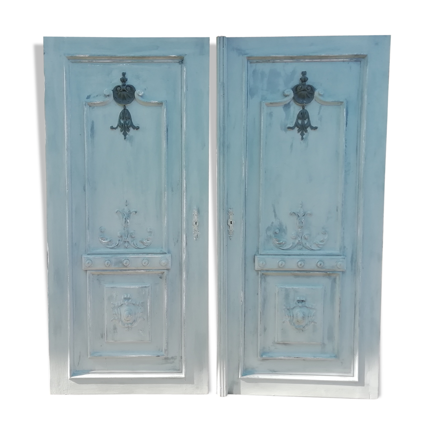 Pair of old door painted in carved wood