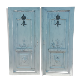 Pair of old door painted in carved wood