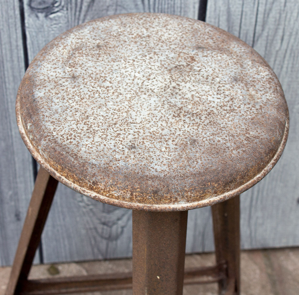 Old industrial stool in metal