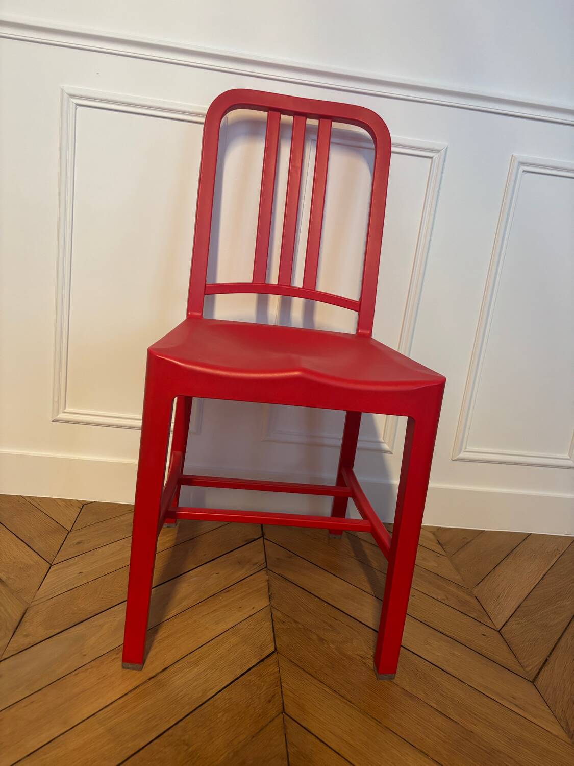 Set of 6 red Emeco chairs