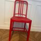 Set of 6 red Emeco chairs