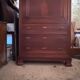 Secretary desk with mahogany and flame veneer.