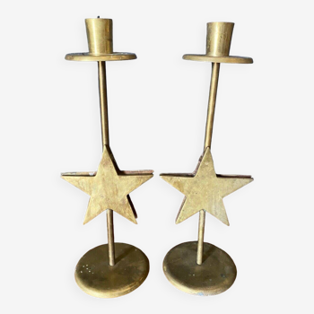 Pair of brass candlesticks decorated with 20th century stars