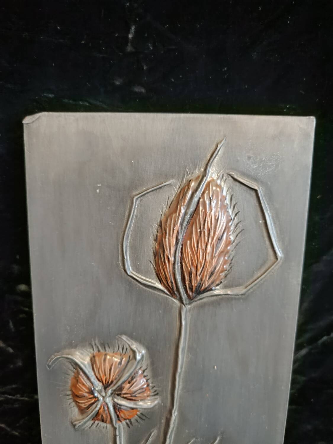 Bas-relief in embossed tin