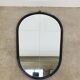 Oval mirror from the 1950s, wrought iron and brass.