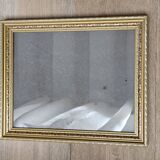 Golden wooden frame with floral patterns