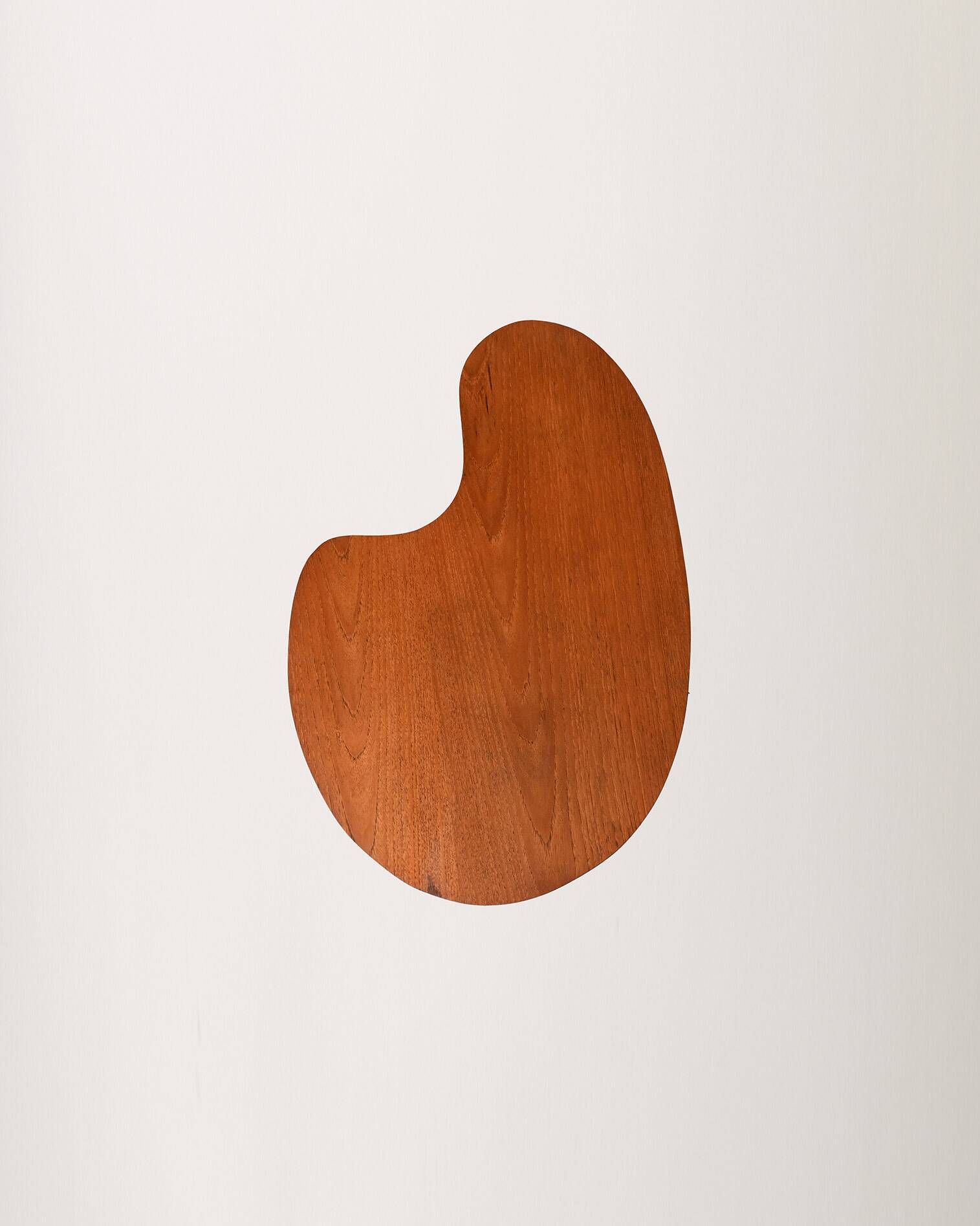 Biomorphic teak and brass side table from the 1950s–1960s