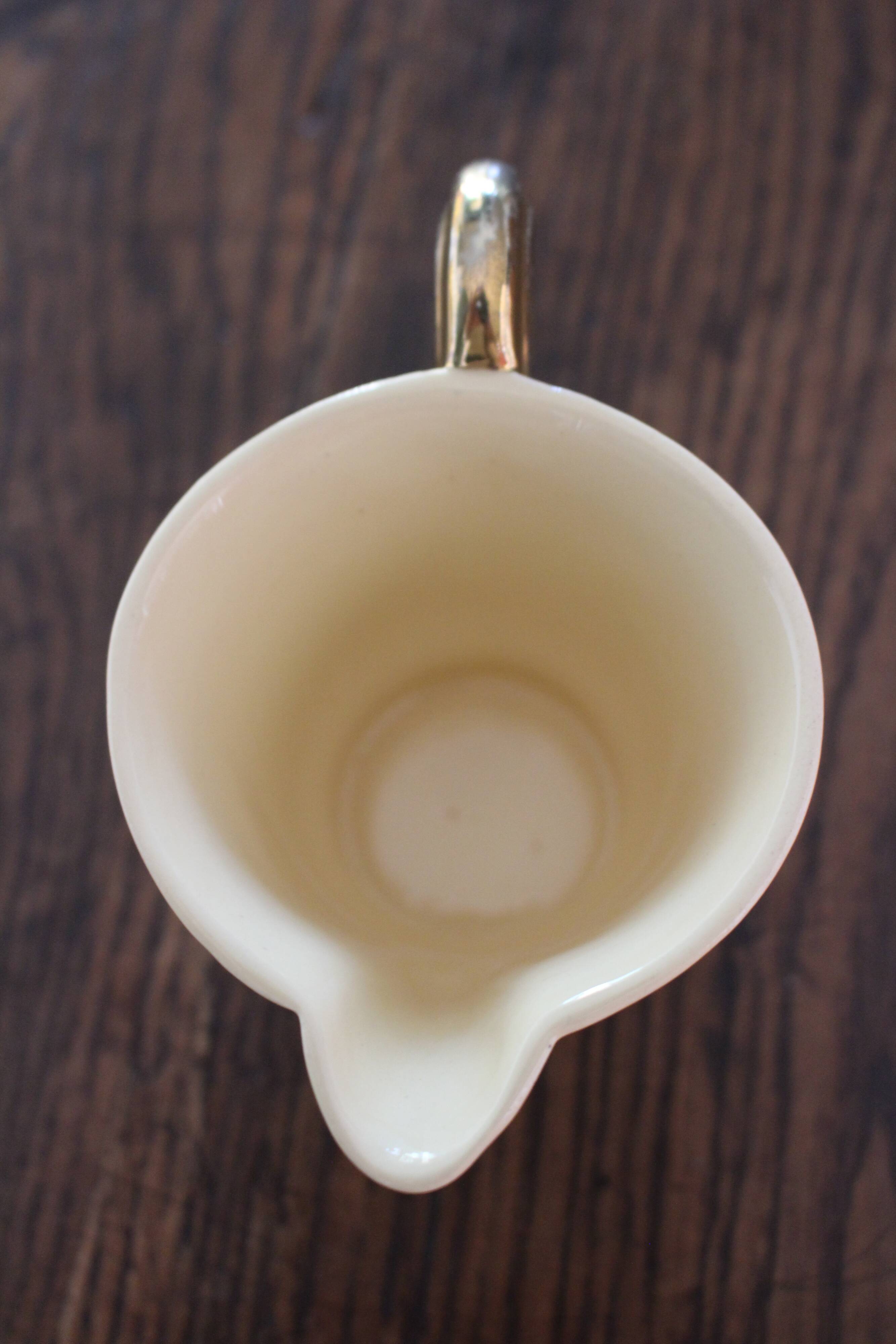 Ecru ceramic milk jug with gold decoration from Sarreguemines.