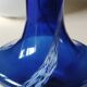 Long flared neck ball vase. Smoked scrolls in cobalt blue art glass, 30cm