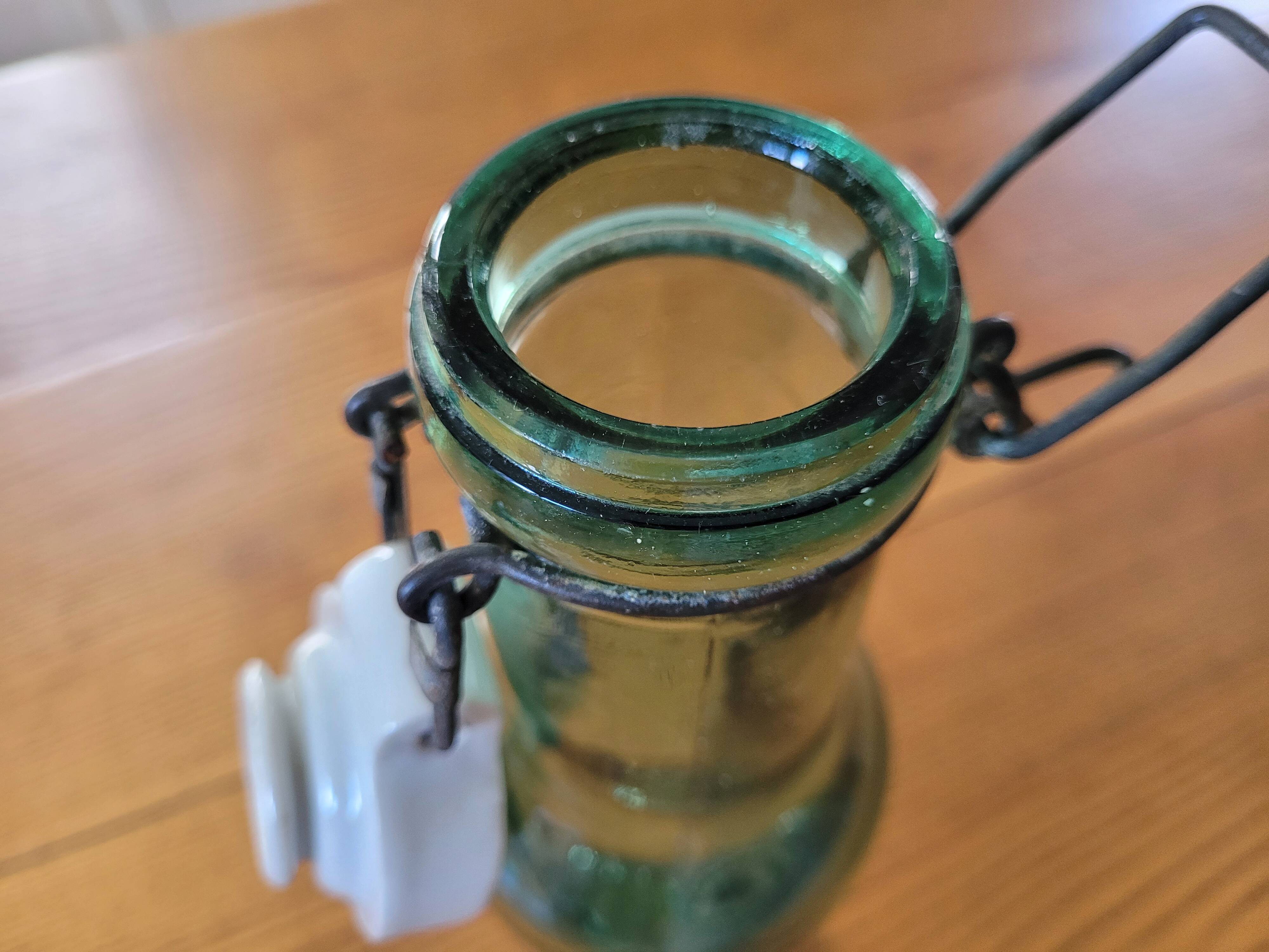 Vintage glass bottle l'Idéale with porcelain stopper