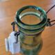 Vintage glass bottle l'Idéale with porcelain stopper
