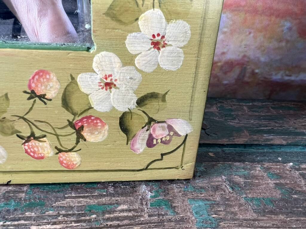 Shabby green mirror with flowers