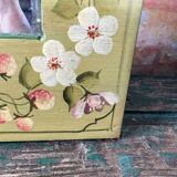Shabby green mirror with flowers
