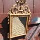 Miroir ancien en bois sculpté et doré