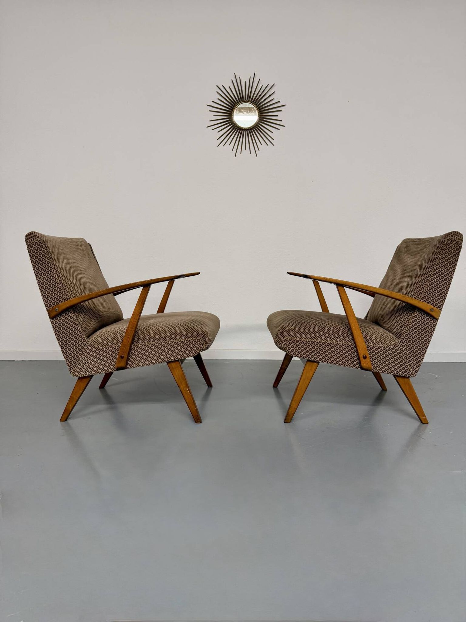 Set of 2 vintage wooden and fabric armchairs designed in the 1960s.